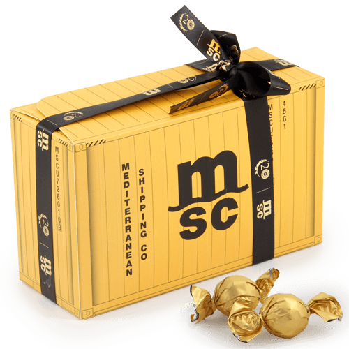 Capacious rectangular candy box with a logo or a printed drawing. 

 Fits when you need sweet business gifts with larger quantities of 
sweets. 

The candies are wrapped in gold-colored paper. You can choose the color 
of the candy labels if Your order will be larger than 300 pcs. Colors: blue, pink, black, green, white and silver.