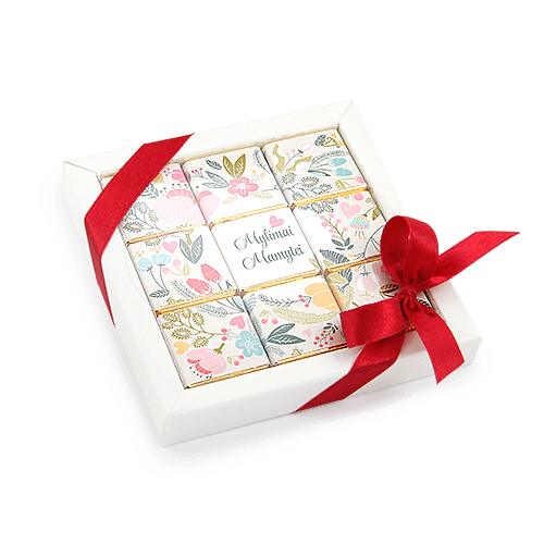 Holiday set of nine chocolates. Chocolate greetings for mommy, baptismal 
mom is put from chocolates decorated from flowered patterns. White box with ribbon.