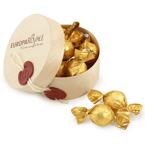 Chocolate candy wrapped in shiny foil in a wooden box with the logo. Brown 
logo or inscription on the cover. Imprint on the decorative embossed wax seal. Linen cord.