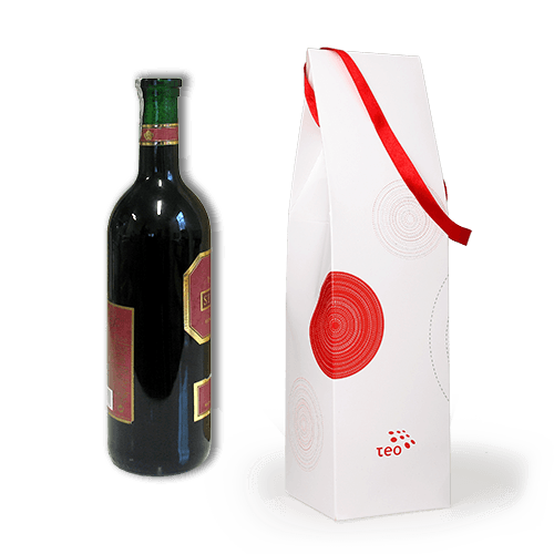 Capacious souvenir box with logo for wine or champagne. The box is with 
a decorative hanger from the satin ribbon. We can offer a variety of sweets to the drink in the set. We produce it custom made.